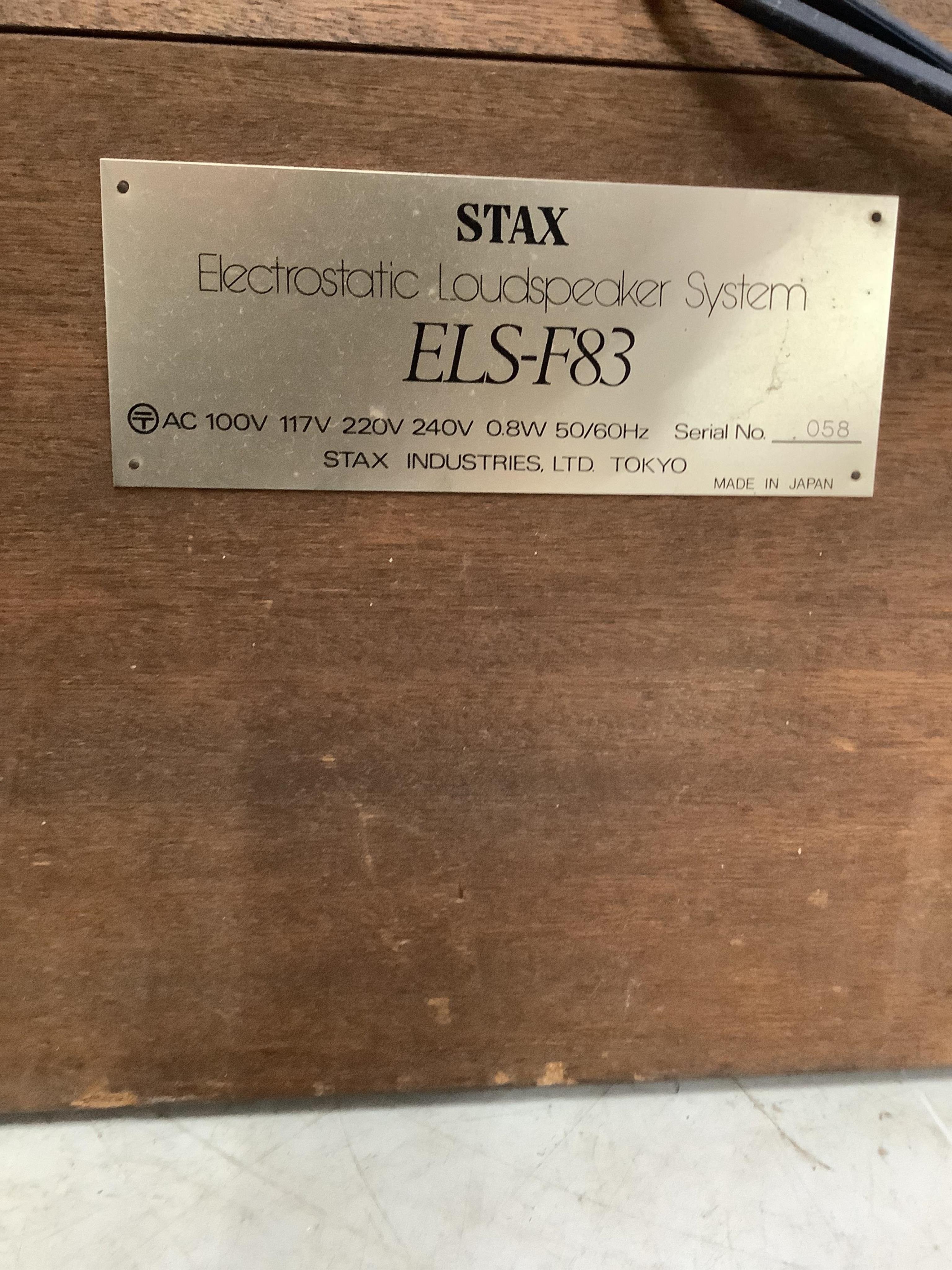 A large pair of floor standing Stax ELS-F83 Electrostatic Stereo speakers, 194cm high. Condition - fair, minor wear to fabric speaker covers, sold untested.